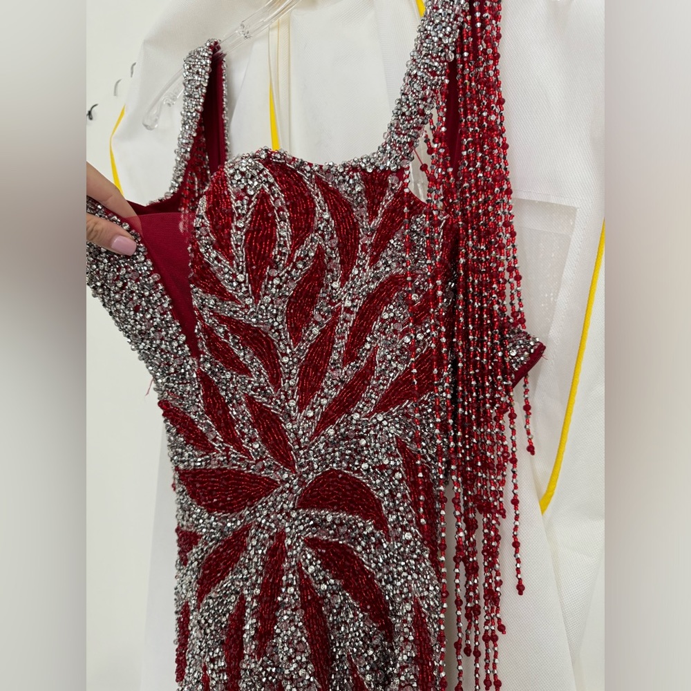Jovani dress. Worn a few hours in a pageant. Worn teice No visible wear or tear.